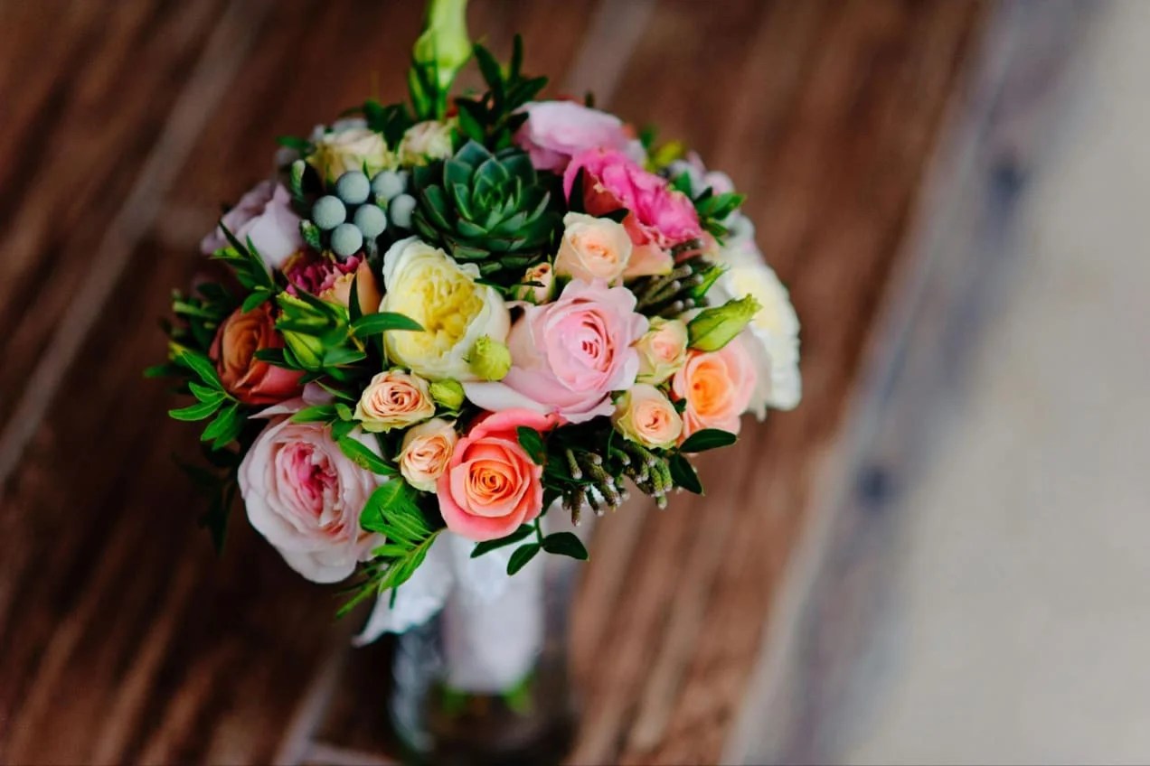 Flower arrangement on a wooden table.