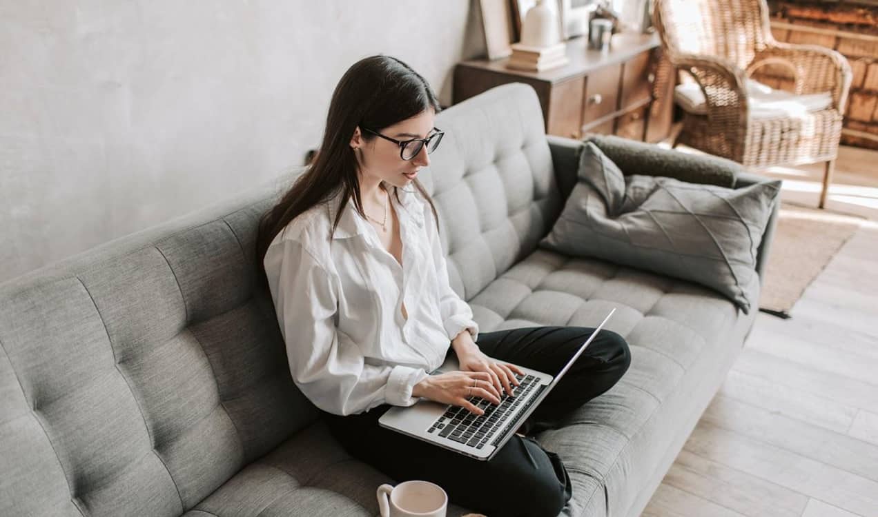 woman working on her computer in a living room