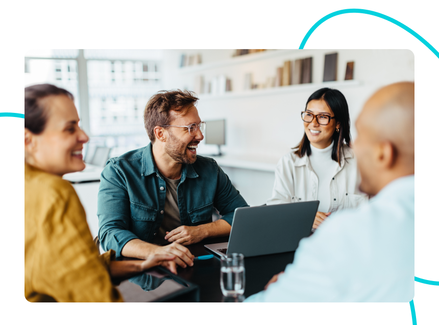 A group of developers, designers and marketers who work in an agency sitting around a table.